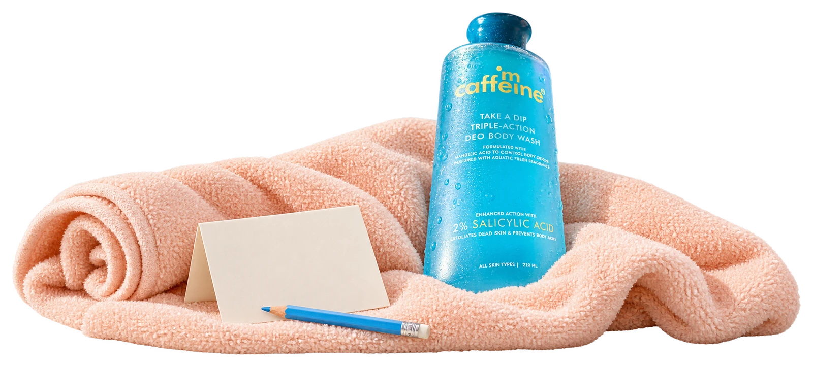 The actual blue Take A Dip body-wash bottle tucked into a soft towel beside an ordinary paper note.